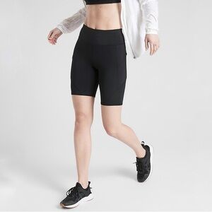 Athleta XS NWOT Contender 9” Black Bike Shorts with Zip Pockets